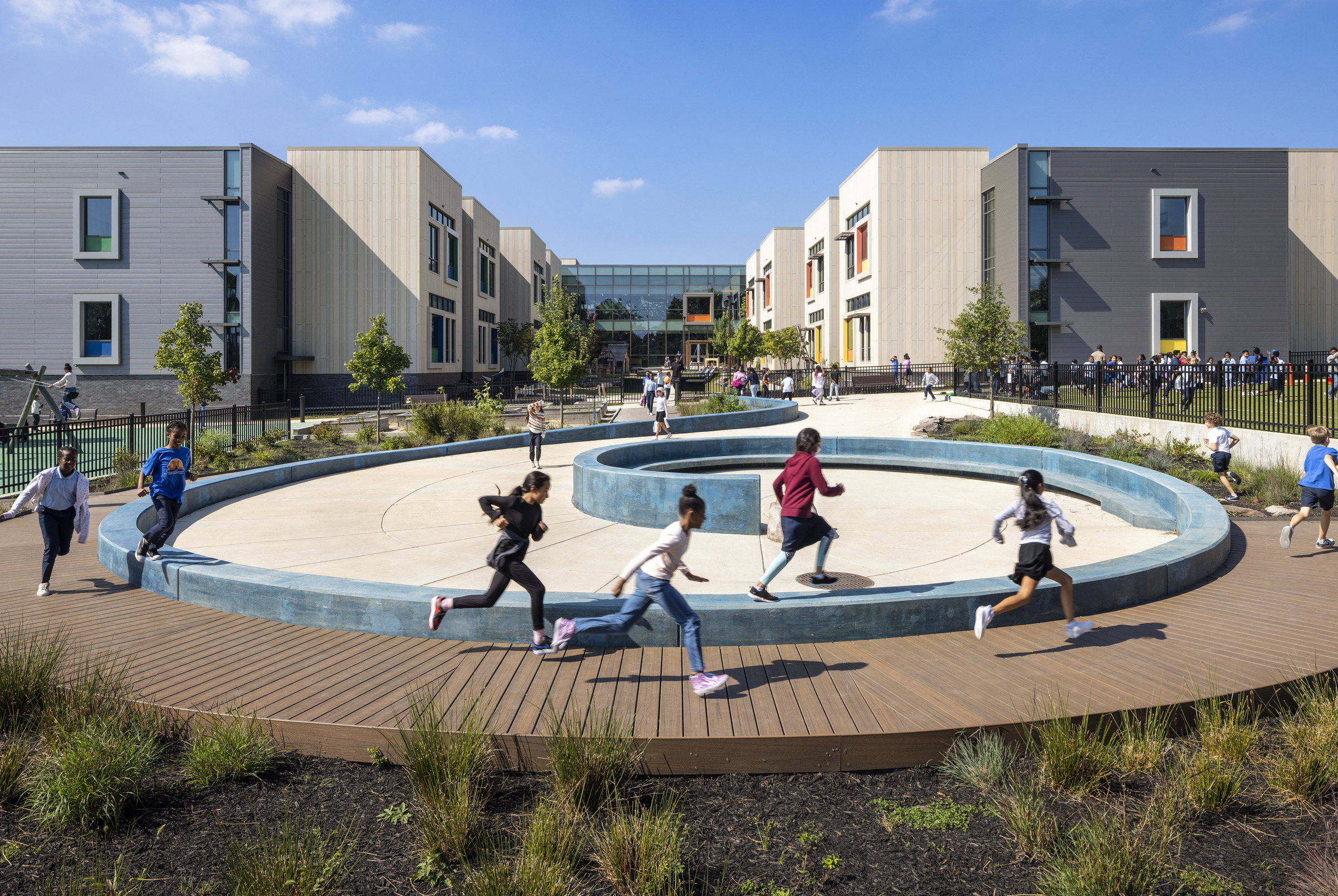 Children play on a playground at John Lewis Elementary School.