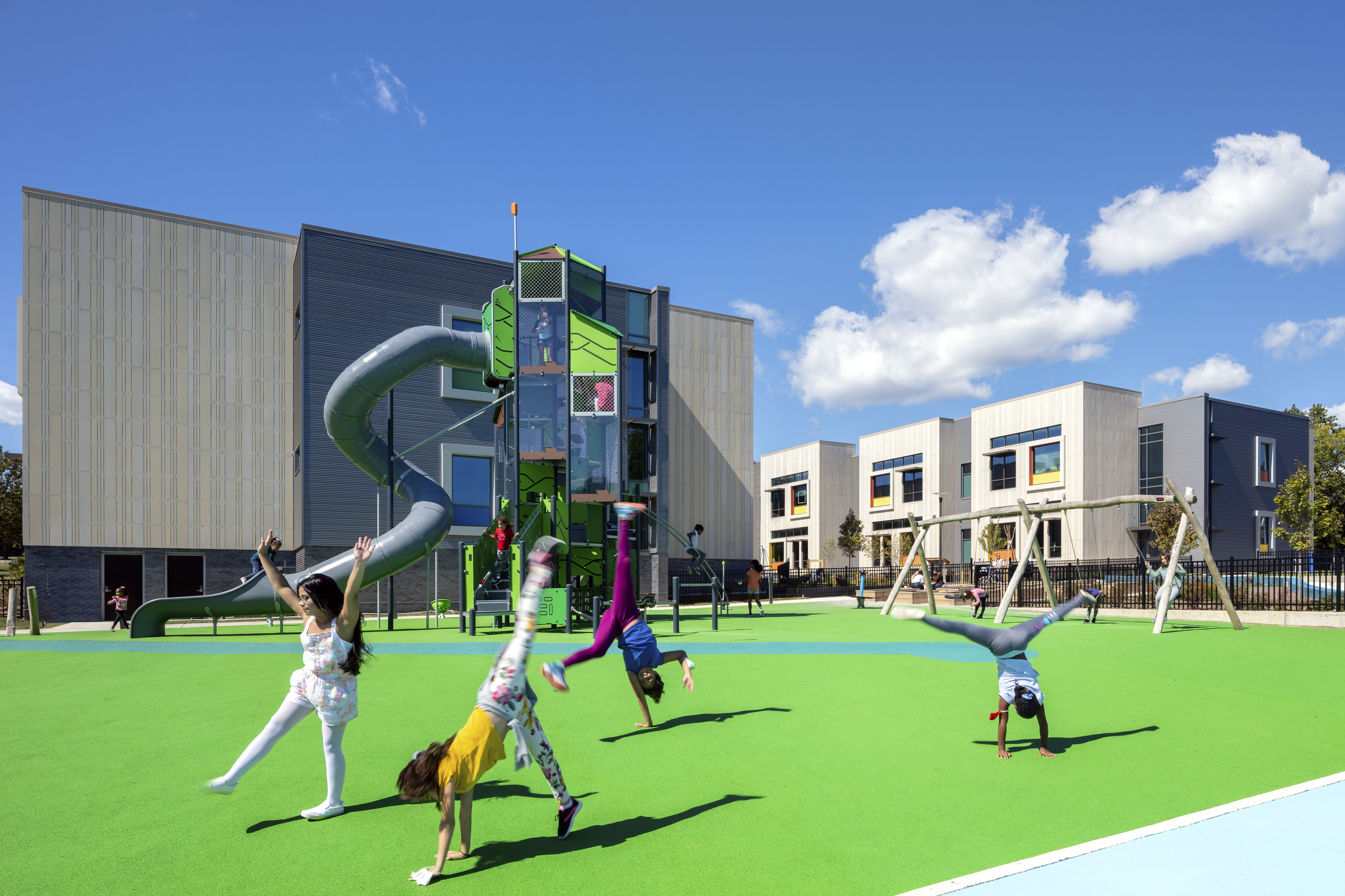 Children play on a playground at John Lewis Elementary School.