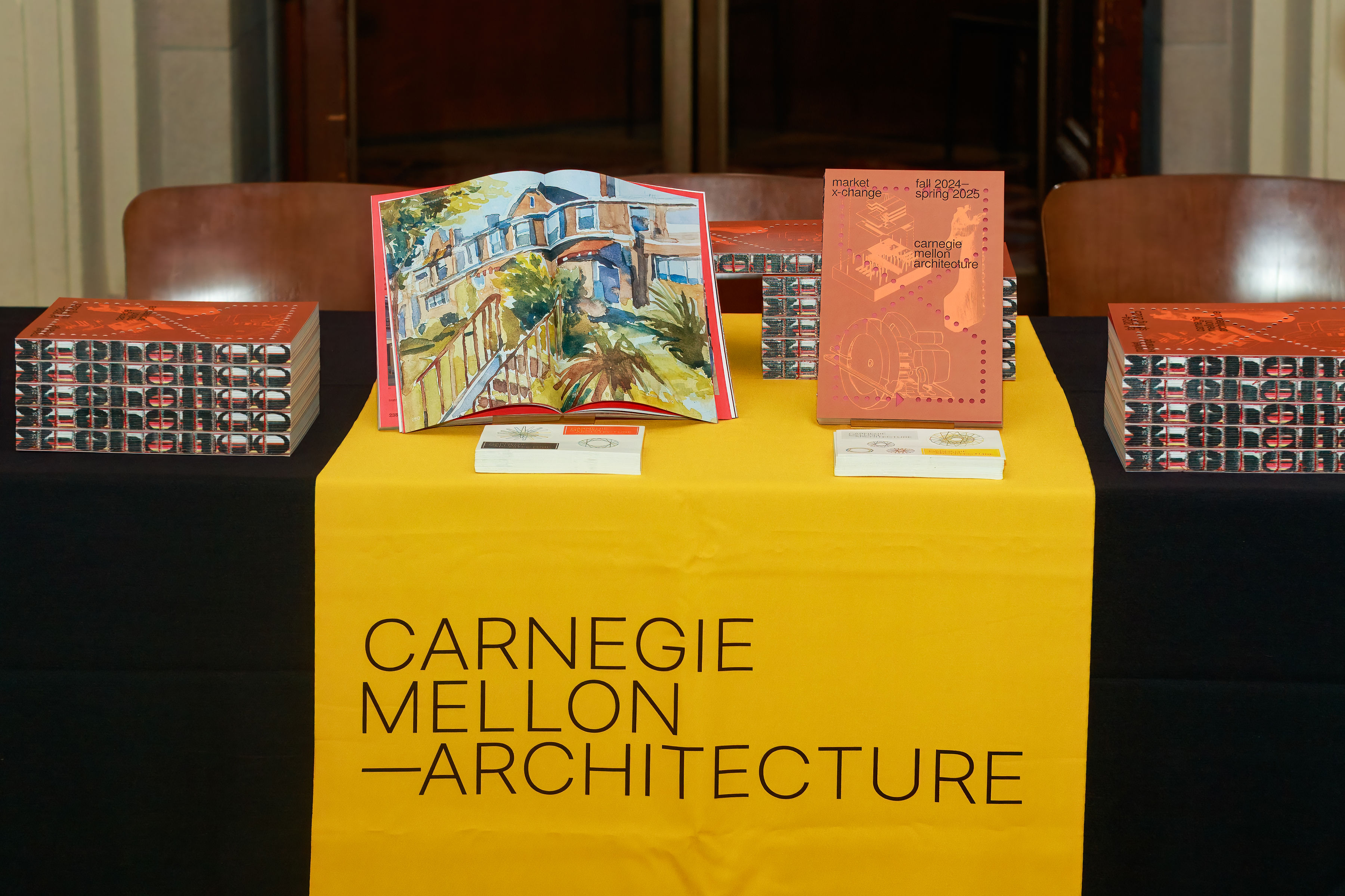 books on a table with a "Carnegie Mellon Architecture" table runner