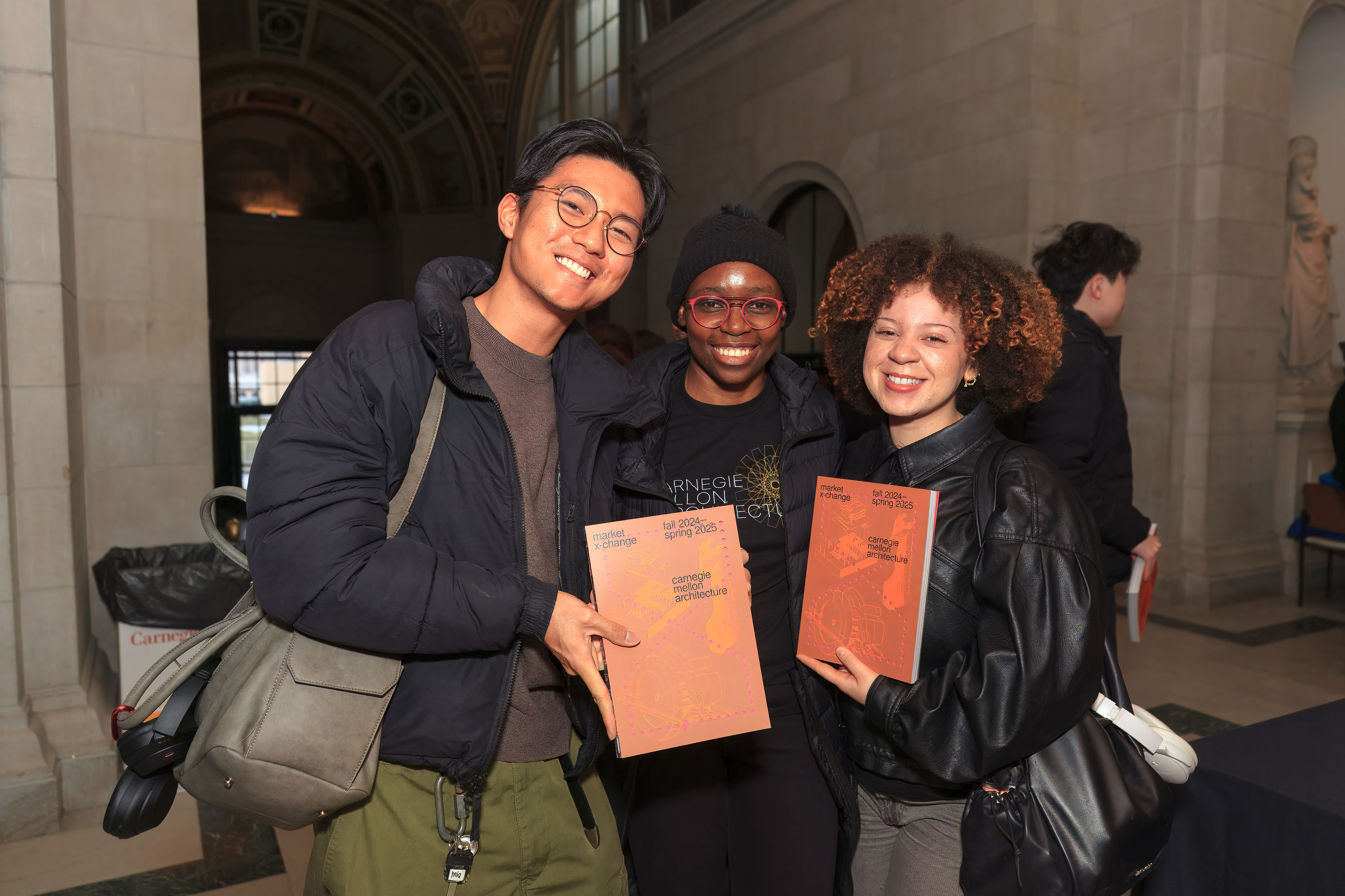 a group poses with books