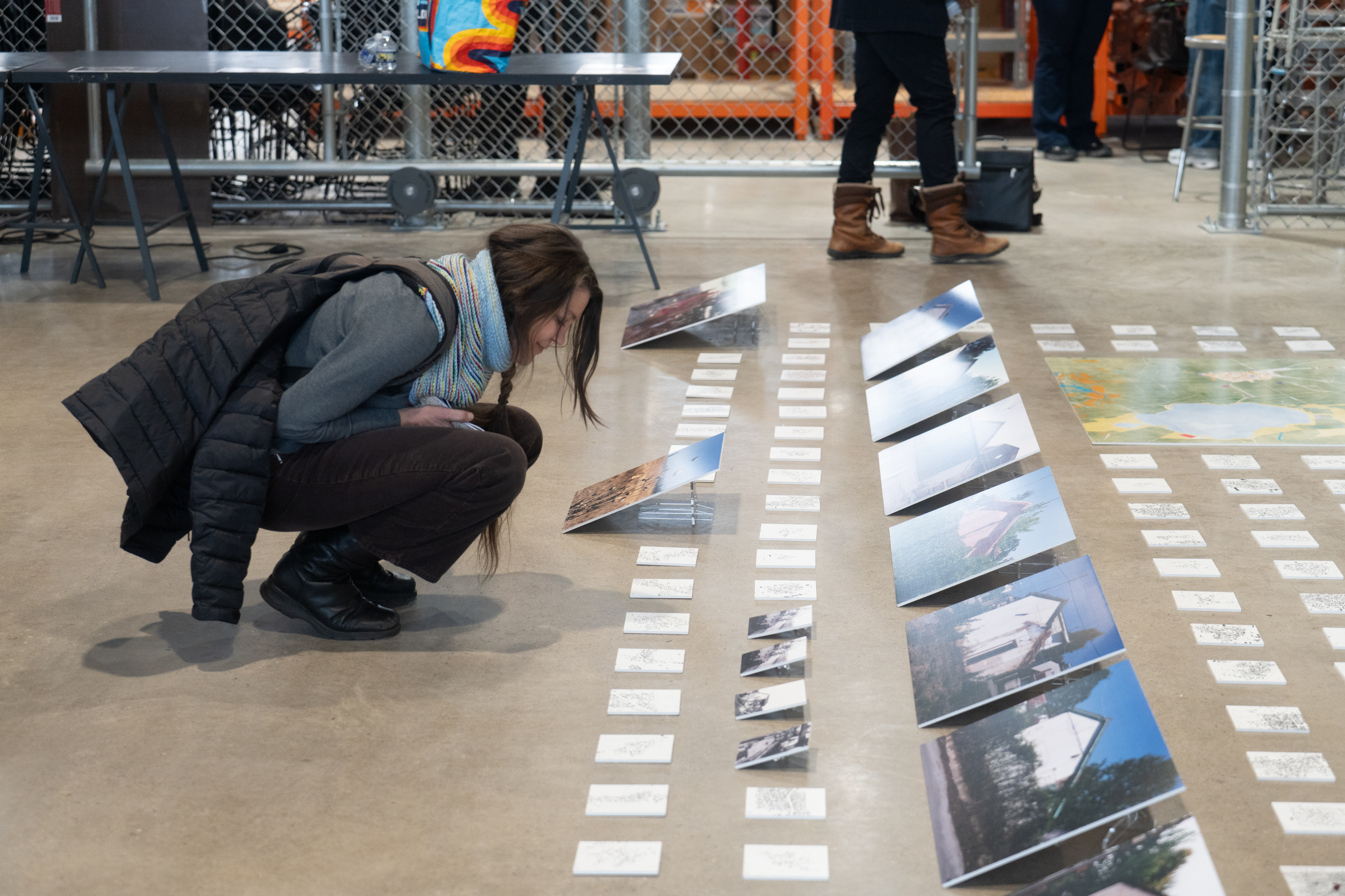 a student admires a display of photographs.