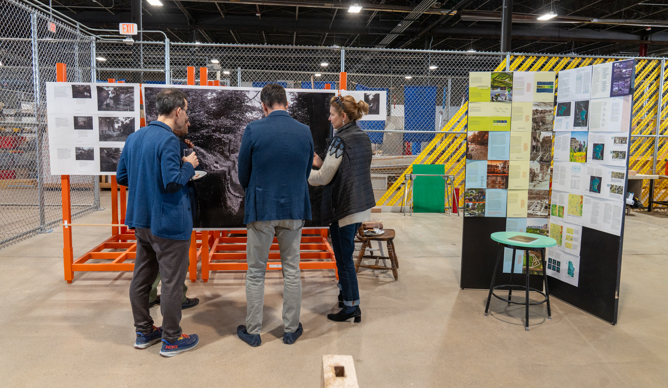 a small group admires a pin-up display