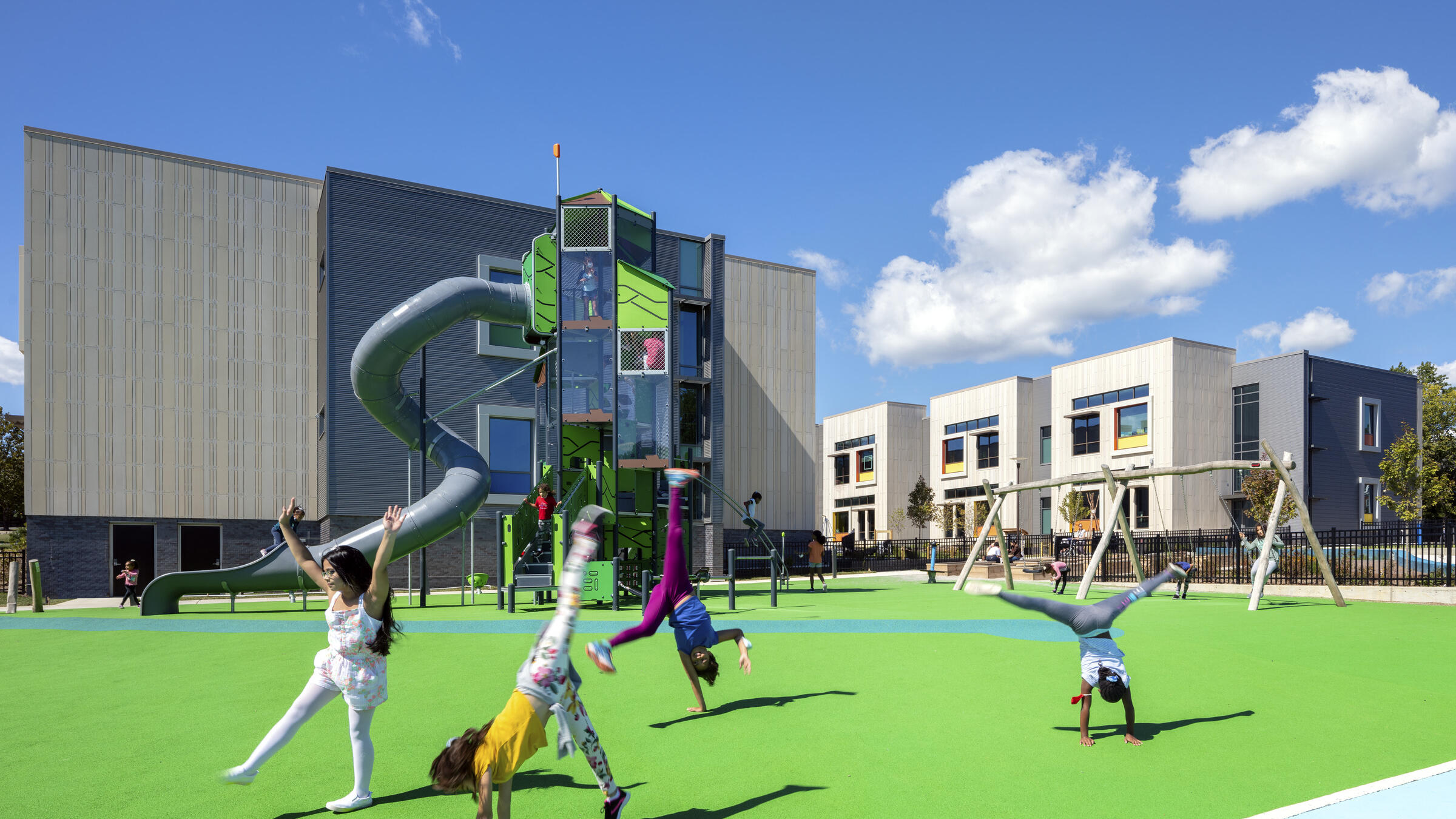 Children play on a playground at John Lewis Elementary School.