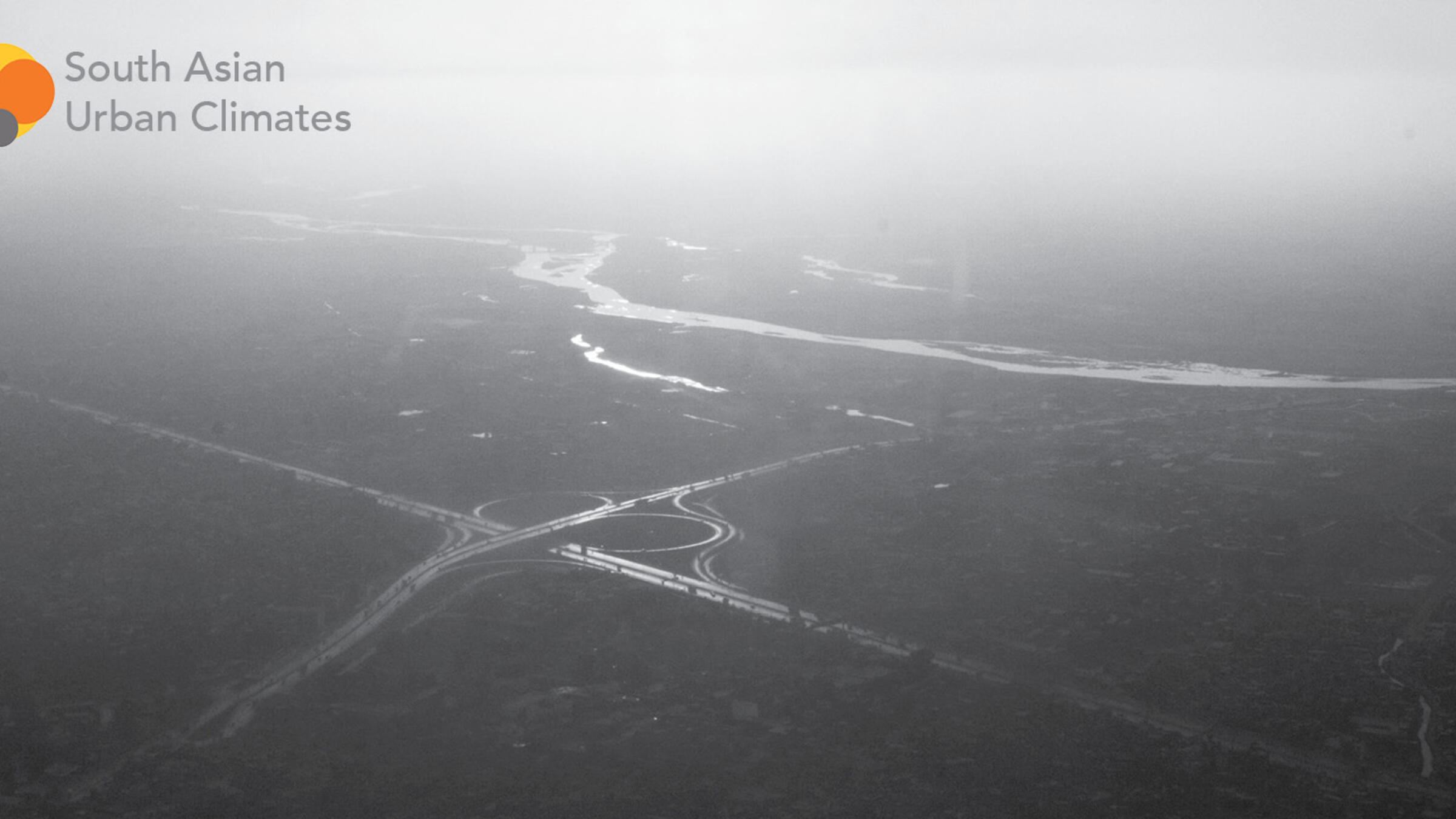 black and white image of a river from afar