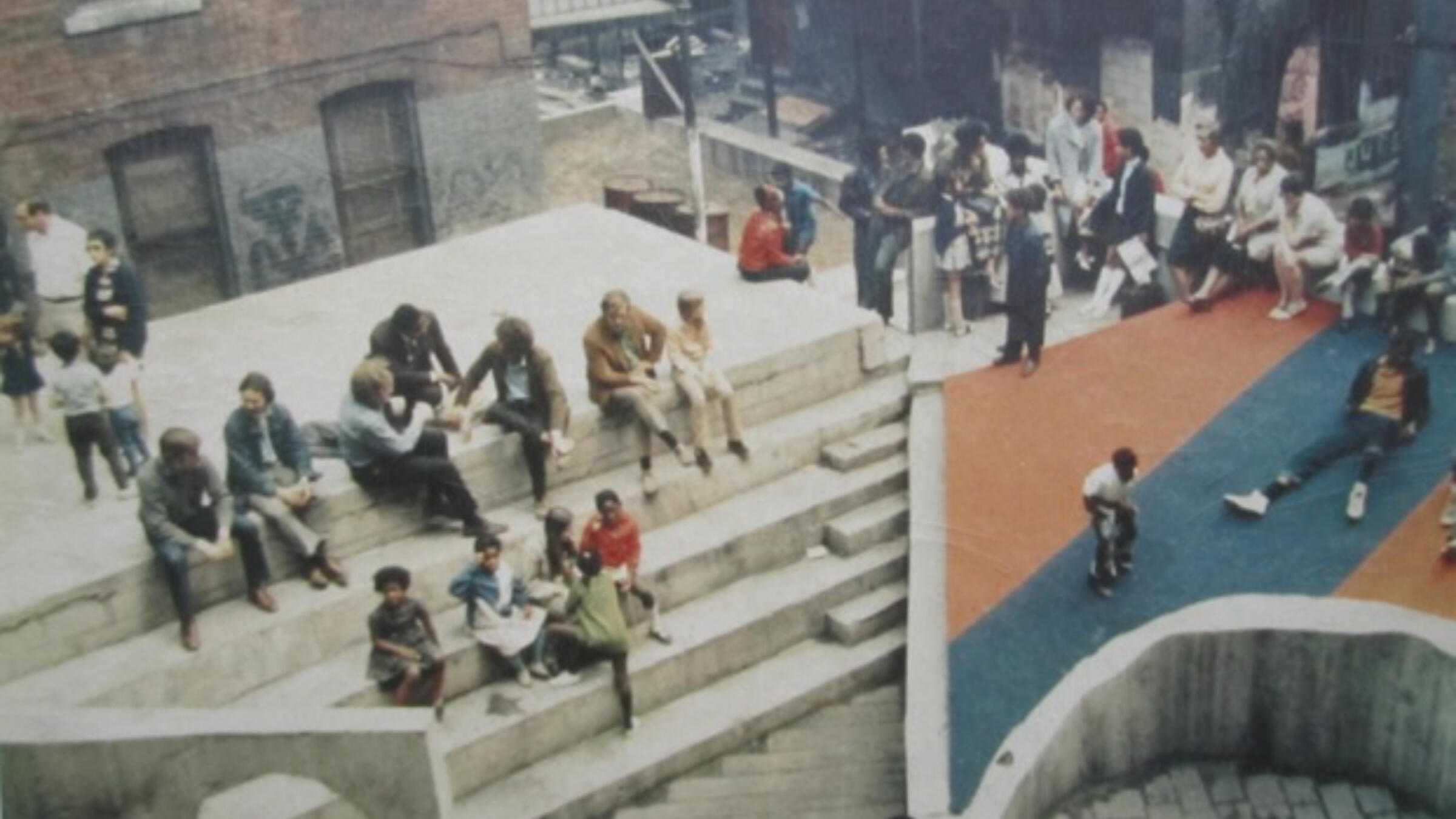 Aerial photo of the Court of Ideas, Hill District, Pittsburgh, 1967. Designer: Architecture 2001/Troy West. The Court of Ideas was a community-built outdoor theater and cultural hub in Pittsburgh’s Hill District in the late 1960s, created as a public platform where residents could gather, speak, and assert their own narratives in the face of urban renewal and displacement.