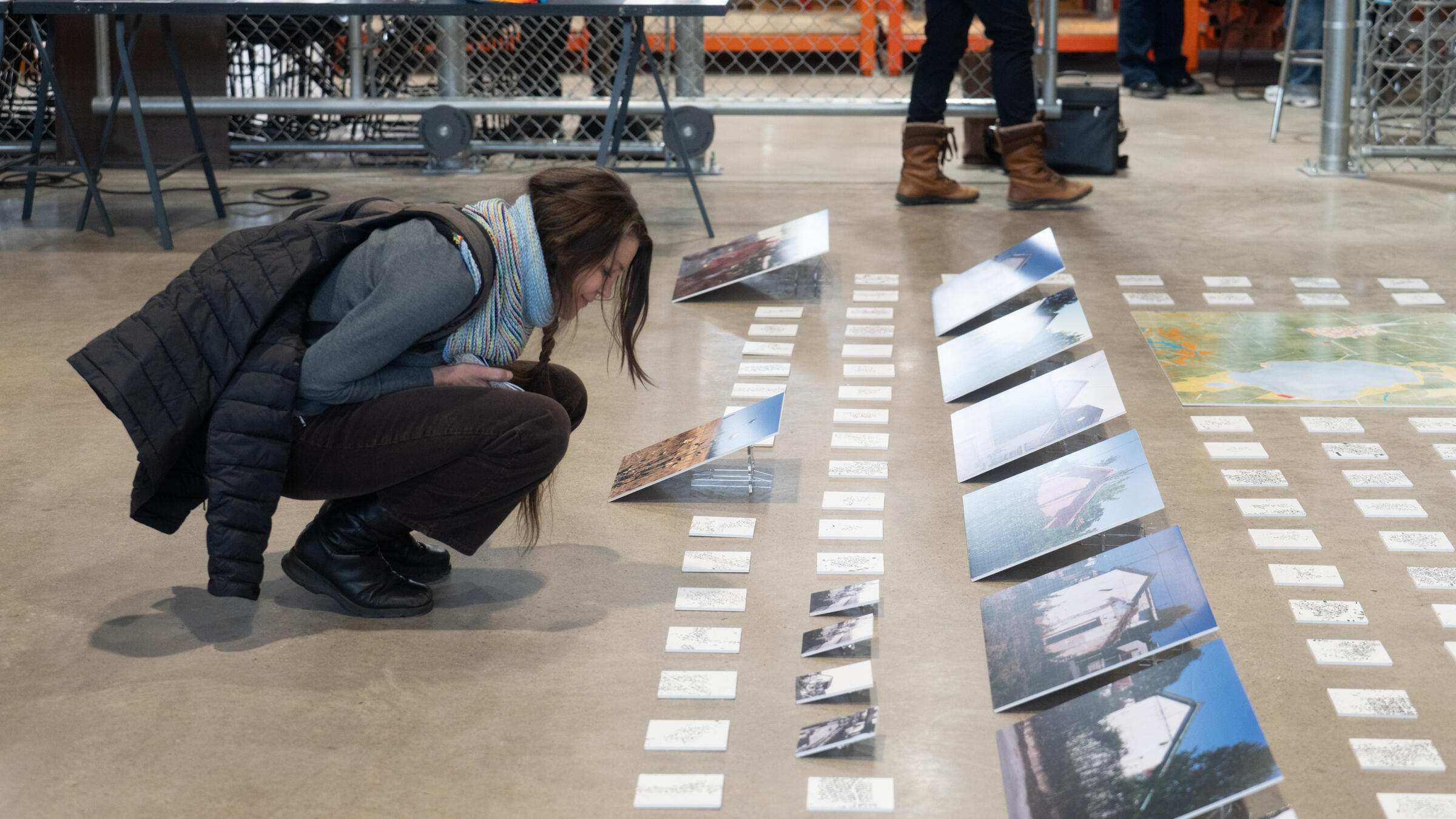 a student admires a display of photographs.