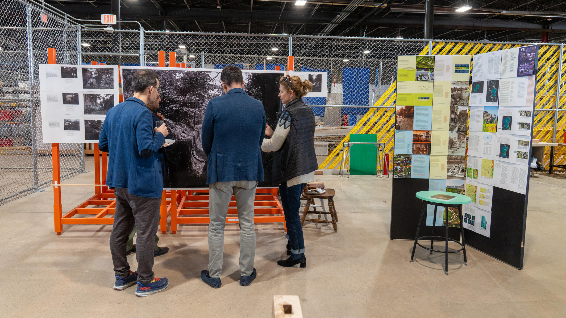 a small group admires a pin-up display