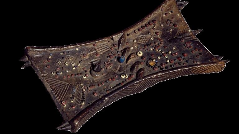Lukasa memory board, hourglass-shaped wooden tablet covered with multicolored beads and carved symbols
