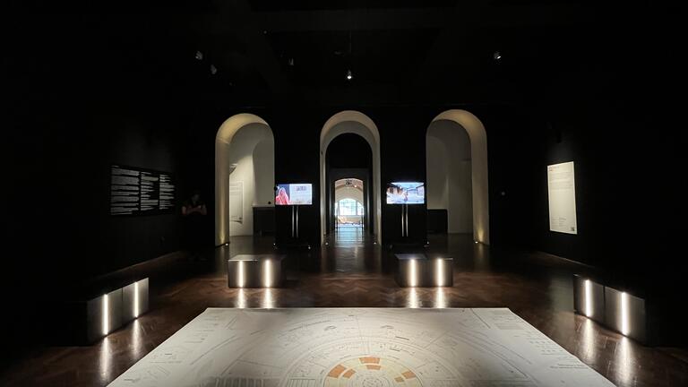 a large drawing on the floor in an exhibition space