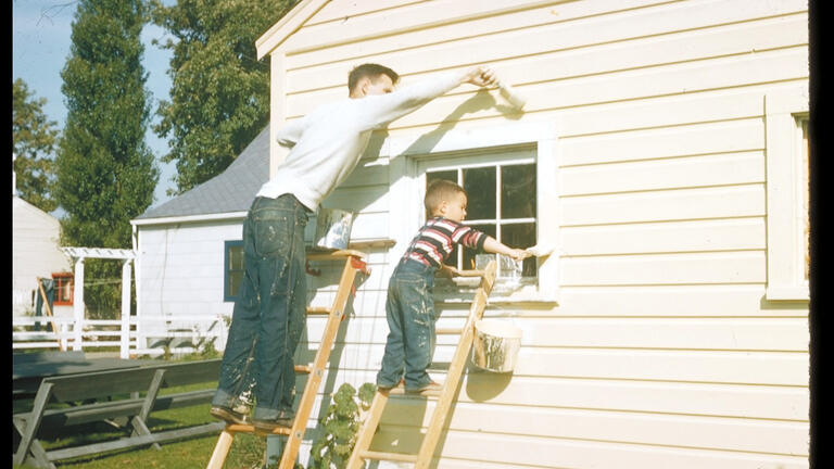 Steve painting with his dad learning that it is best not to work below someone else.