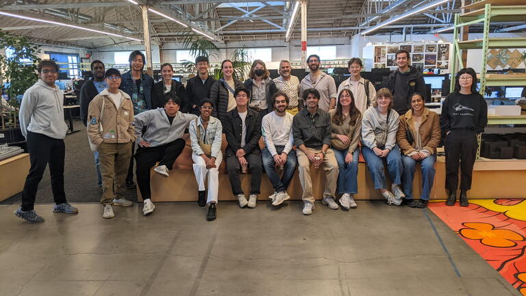 a large group of students poses for a photograph