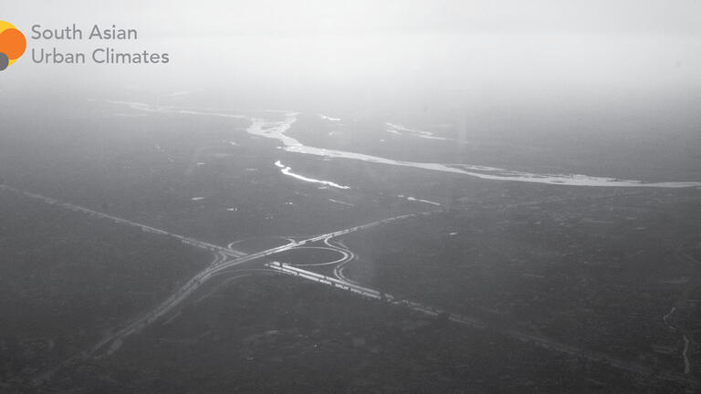 black and white image of a river from afar