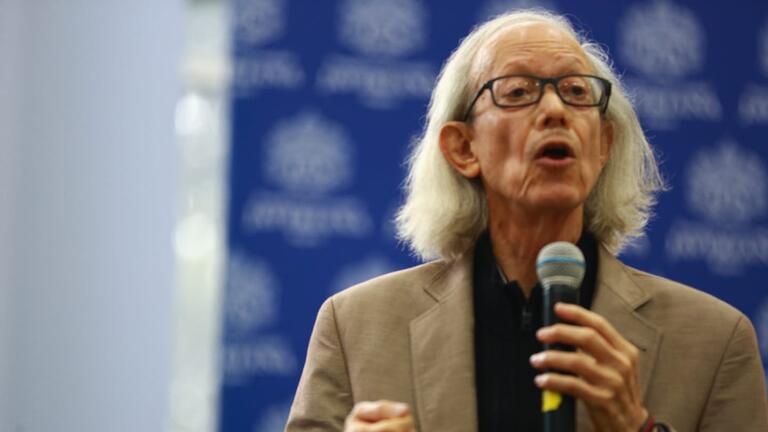 Arturo Escobar speaking at an event