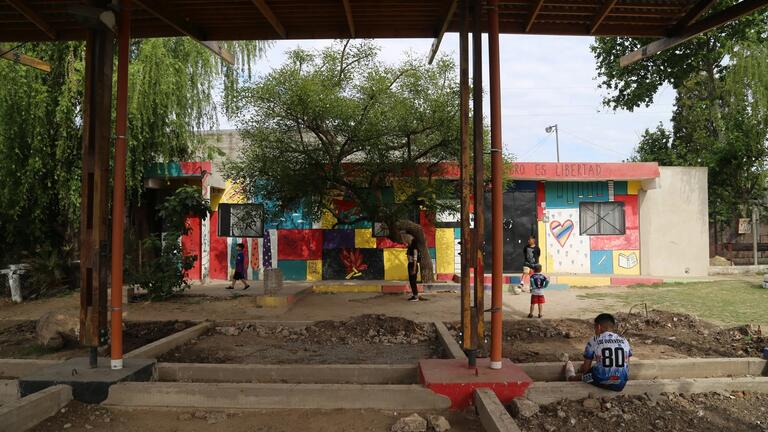 colorful buildings seen from across a courtyard