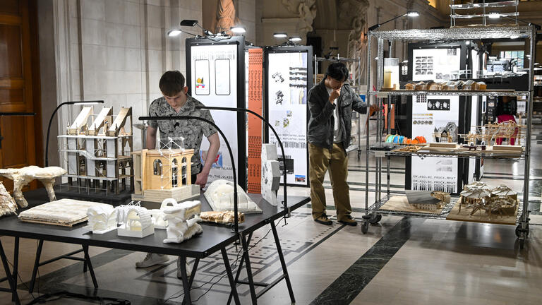 visitors in the great hall admire the exchange exhibition
