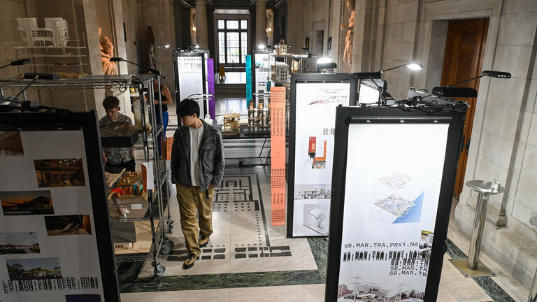 visitors in the great hall admire the exchange exhibition