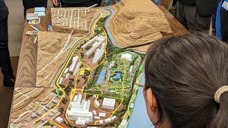 Community meeting at North Braddock Borough building with model of Edgar Thomson Steel Works site. Photo by Seyoung Choo, spring 2023.