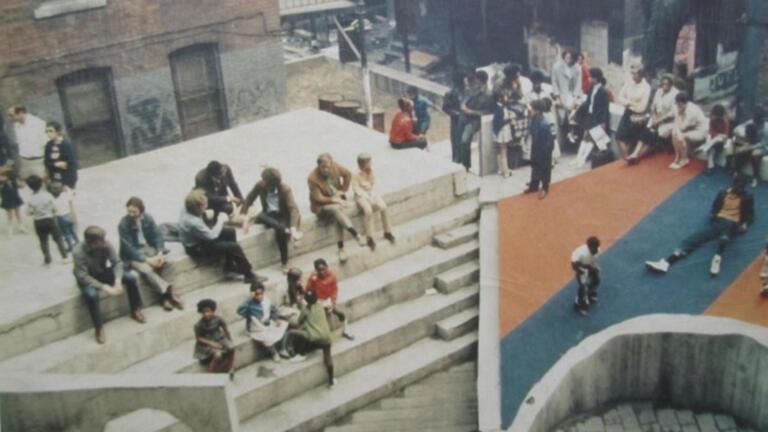 Aerial photo of the Court of Ideas, Hill District, Pittsburgh, 1967. Designer: Architecture 2001/Troy West. The Court of Ideas was a community-built outdoor theater and cultural hub in Pittsburgh’s Hill District in the late 1960s, created as a public platform where residents could gather, speak, and assert their own narratives in the face of urban renewal and displacement.