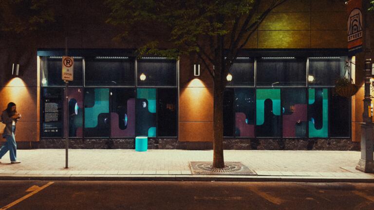 image of sidewalk at night lit by streetlights