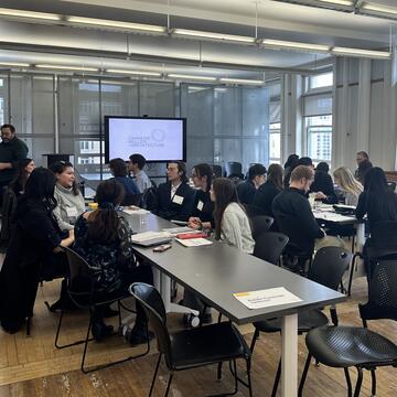 groups sit around tables