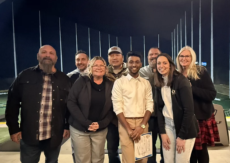 CMAA Three Rivers chapter board members award a Presidential Scholarships to Jerome Suraj Karunairaj (MSAECM '26) during their Marine Toys for Tots Foundation benefit on December 8, 2025.