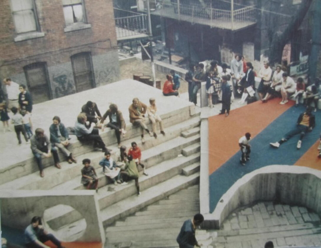 Aerial photo of the Court of Ideas, Hill District, Pittsburgh, 1967. Designer: Architecture 2001/Troy West. The Court of Ideas was a community-built outdoor theater and cultural hub in Pittsburgh’s Hill District in the late 1960s, created as a public platform where residents could gather, speak, and assert their own narratives in the face of urban renewal and displacement.